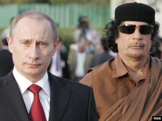 Then Russian President Vladimir Putin (left) and Libyan leader Muammar Qaddafi at Qaddafi's residence within the Bab al-Aziziya barracks in Tripoli in April 2008