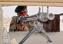 Afghnaistan/Pakistan -- A Pakistani Paramilitary soldier stands alert at the border crossing at Chaman, 30 Mar. 2006