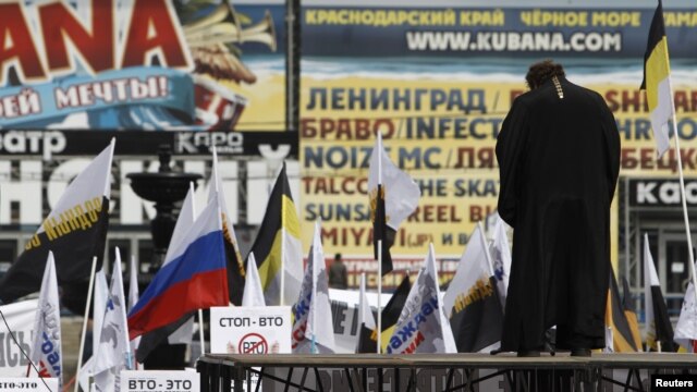 An Orthodox priest addresses the crowd during a rally by nationalist and religious political groups in Moscow in April 2012.