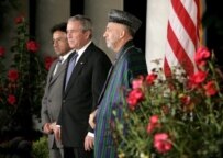 Musharraf (left), Bush (center), and Karzai at the White House in September epa)