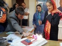 Iranian journalists lit candles on a birthday cake for Alan Johnston at the United Nations office in Tehran (AFP)