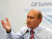 Vladimir Putin speaking to reporters at the G8 summit today (epa)