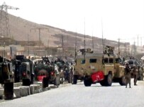 NATO forces secure site of a suicide bomb attack in Kandahar on June 15 (epa)