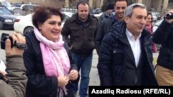 Azerbaijani investigative journalist Khadija Ismayilova (left) outside the Prosecutor General's Office in Baku in February with her lawyer Elton Guliyev. Ismayilova fears she will soon be detained as part of a crackdown on civil society in Azerbaijan.