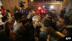 Nine Lebanese hostages are greeted by cheering crowds in Beirut.