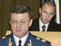 President Putin (right) listens as Prosecutor-General Yury Chaika delivers his speech on November 21 (ITAR-TASS)
