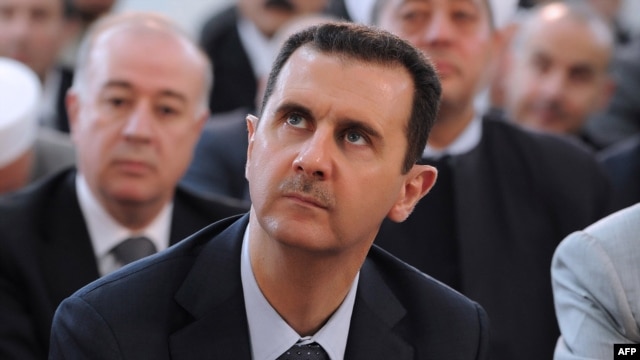 Syria -- President Bashar al-Assad attends Eid al-Fitr payers in Damascus, 19Aug2012