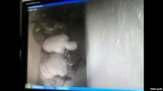 A still from a video circulating that is thought to be of police abusing prisoner Pavel Drozdov, who died in police custody in February.