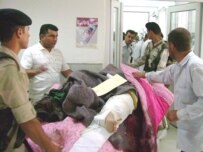 An Iraqi injured in the bomb blasts is brought to a hospital in Dahuk, a Kurdish city near the Turkish border (epa)