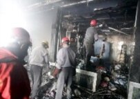 Emergency team at work in Ahvaz following a double bomb attack on 24 January (epa)