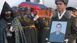 Armenia - The funeral of Lieutenant Gurgen Markarian, an Armenian army officer who was axe-murdered by an Azerbaijani colleague during a NATO training course in Budapest, 25Feb2004.