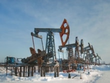 Russia -- Nodding donkey oil pumps at Yermakovskoye oilfield operated by Tyumenneftegaz, a TNK-BP subsidiary, Nizhnevartovsk District, 05Feb2007