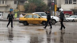 مياه مع أول هطول للأمطار في شوارع بغداد
