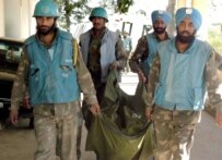 Indian observers in UN mission in Lebanon carrying away the body of a colleague killed by Israeli air strikers on an observer post on July 25 (epa)