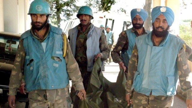 Indian observers in UN mission in Lebanon carrying away the body of a colleague killed by Israeli air strikers on an observer post on July 25 (epa)