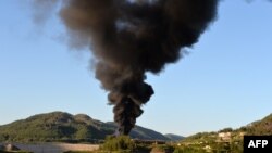 Smoke rises after shelling in the Al-Turkman Mountains in Syria's western Latakia Province on April 25. The United States said last week that it has evidence that chemical weapons have been used during the conflict in Syria.