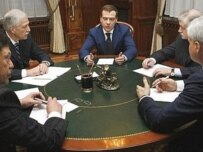Dmitry Medvedev (middle) will get lots of help (AFP)