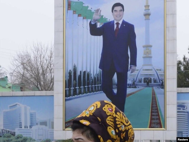 A campaign billboard displays a portrait of President Gurbanguly Berdymukhammedov in Ashgabat.