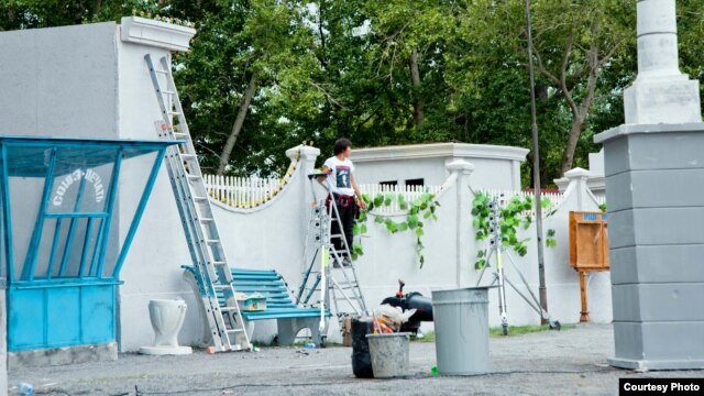 A film crew member works on a set for "The Way Of The Leader" Temirtau on August 22.