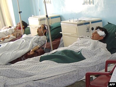 Wounded Afghan men receive treatment at a hospital in Charikar, in northern Afghanistan, following a car bombing in late December.