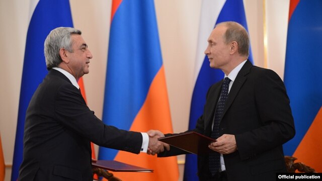 Armenian President Serzh Sarkisian (left) talks with his Russian counterpart Vladimir Putin near Moscow.