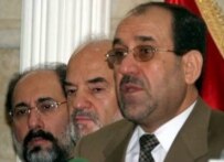 Al-Jafari (center) looks on as al-Maliki (right) meets reporters after being nominated prime minister in April 2006 (epa)