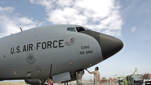 U.S. soldiers inspect military planes at the Manas air base in Kyrgyzstan. 