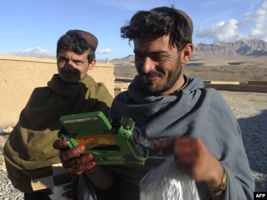 Dutch soldiers gave a radio to these villagers in Afghanistan's southern Uruzgan Province in January.