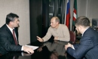 Putin (center) may now prefer Alkhanov (left) to Kadyrov (right) (ITAR-TASS)