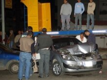 Lebanon - Lebanese inspectors take evidences from the damaged vehicle at the site where prominent anti-Syrian Christian Minister Pierre Gemayel was assassinated in Jdeideh suburb of Beirut, 21Nov2006