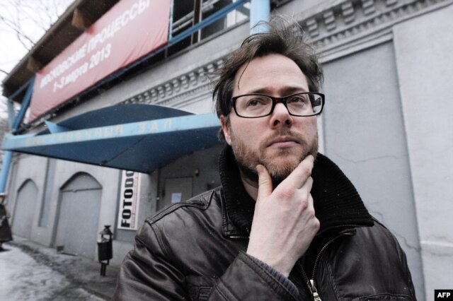 Swiss director Milo Rau stands outside the Sakharov Center.