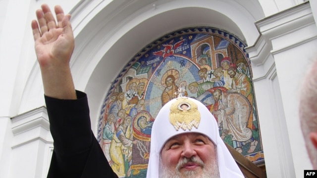 Patriarch of Moscow and All Russia Kirill waves during his visit to Odesa on July 20.