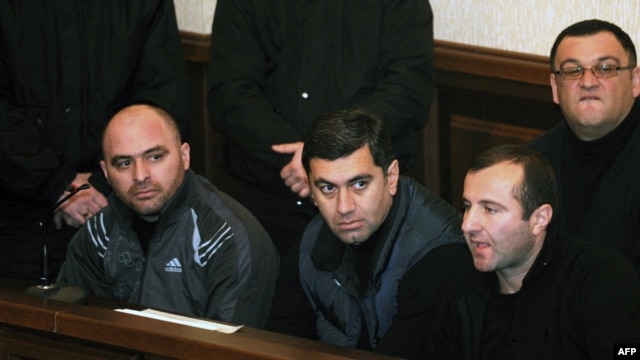Former Defense Minister Irakli Okruashvili (second from left) sits in a Tbilisi court on December 10.