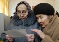 Women inspect a ballot today in Bishkek