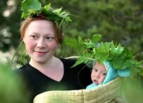 Young mother and child during the Russian summer solstice, Ivan Kupala Day, a pagan fertility rite that is now part of the Orthodox calendar (ITAR-TASS)