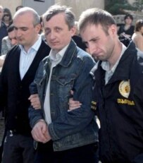 Georgian citizen Victor Orekhov (center) is escorted to the Tbilisi City Court (epa)
