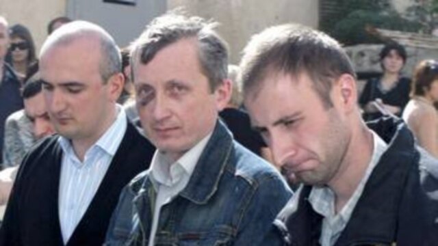 Georgian citizen Victor Orekhov (center) is escorted to the Tbilisi City Court (epa)