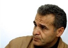 Iraq -- Iraqi Kurdish journalist and writer Kamal Sayyid Qadir talks to the press after his release in Irbil, 350 kms north of Baghdad, 24 Jan. 2006