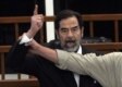 Former Iraqi leader Saddam Hussein shouts at the court as he is sentenced to death on November 5 (AFP)