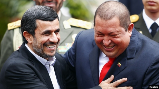 Iran's President Mahmud Ahmadinejad (left) is welcomed by Venezuela's President Hugo Chavez in Caracas in January 2012.