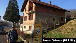 Marko Pranjic from the village of Makljenovac stands outside his home, which straddles the both the dividing line between two of Bosnia-Herzegovina's ethnically based entities.