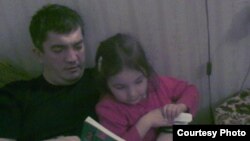 Marat Gunashev, seen here with his daughter in an undated family photo, has been held in detention since being apprehended on November 28 in the operating theater of the Makhachkala hospital where he worked.