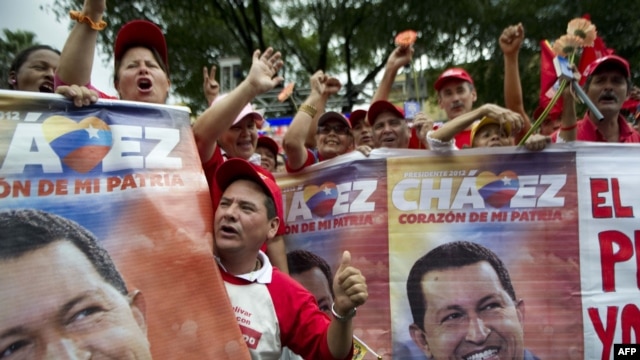 Supporters of ailing Venezuelan President Hugo Chavez rally outside the presidential palace in Caracas on January 10.