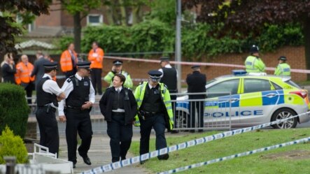 U.K. -- Police officers man a cordoned off area in Woolwich, east London following an incident in which a man was killed and two others seriously injured, 22May2013