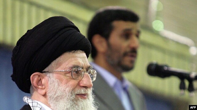 In a photo released by his official website, Supreme Leader Ayatollah Ali Khamenei listens to a speech by President Mahmud Ahmadinejad during an official ceremony in Tehran.