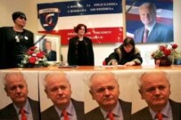 Supporters of Slobodan Milosevic sign a book of condolences in the headquarters of the pro-Milosevic support group \