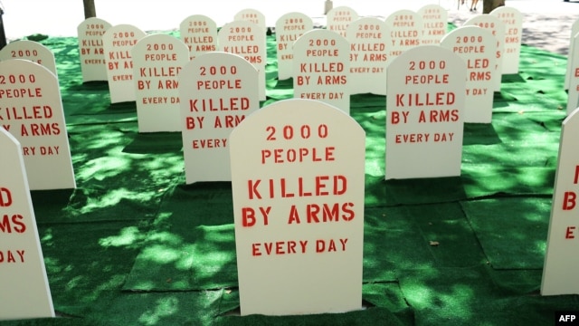 Activists erected a mock graveyard across from the United Nations to highlight the need for an arms treaty.