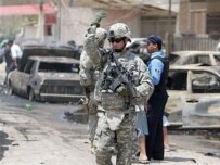 A U.S. soldier at the site of a May car bomb blast in Baghdad (AFP)