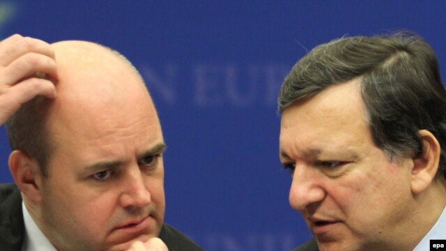 As Swedish Prime Minister Fredrik Reinfeldt (left) hosts the meeting where the EU will pick its first president, European Commission President Jose Manuel Barroso looks forward to sharing a podium with another president.