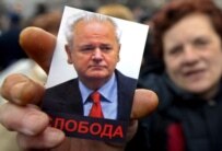 A Kosovar Serb holds a picture of Milosevic at a demonstration in Belgrade earlier this month (epa)
